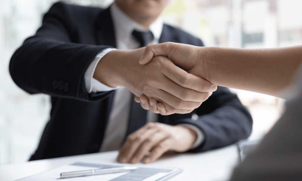two people shaking hands