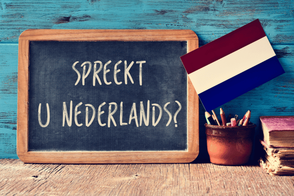 Chalkboard with “Spreekt u Nederlands?” and Dutch flag