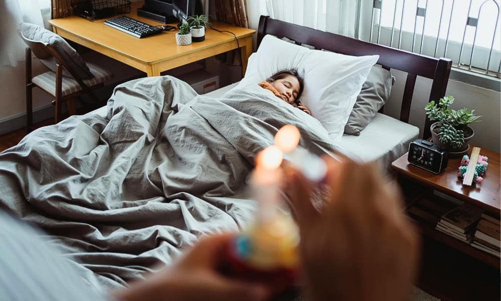 child asleep in bed